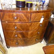 A Victorian mahogany bow front chest with two short above three long drawers on turned feet