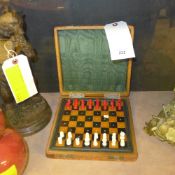 A leather cased travelling cess set