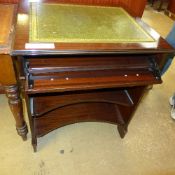 A mahogany writing desk the tooled leath