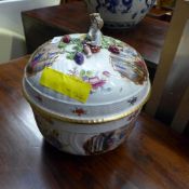 A Meissen style tureen with pictorial relief