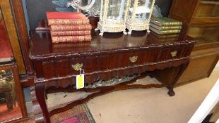 A mid C20th serving table the carved bac