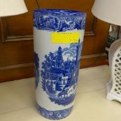A blue and white umbrella stand