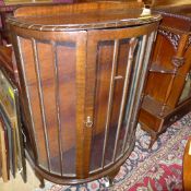 A C20th demi-lune mahogany display cabin
