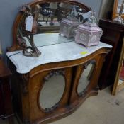 A Victorian walnut credenza the serpenti
