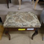 A C20th mahogany music stool with hinged