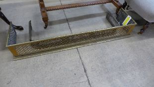 A C19th brass pierced fender and a simil