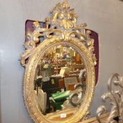 A gilded pier mirror the oval bevelled p