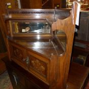 An Edwardian marquetry inlaid walnut hanging corner cupboard with pierced gallery and mirrored