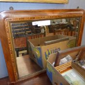 A Victorian walnut overmantel mirror with arched plate