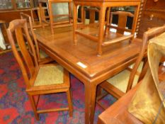 A Chinese hardwood dining table and eigh