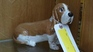 A pottery model of a basset hound impres