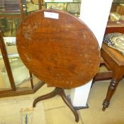 A George III mahogany circular top raise