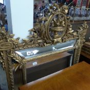 A gilted sectional wall hanging mirror