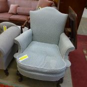 A C20th mahogany armchair upholstered in