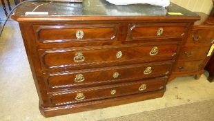 A C19th French flame mahogany commode the green marble top above four drawers with gilt metal
