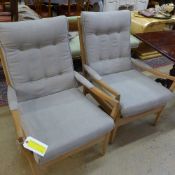 A pair of 1950's bleached armchairs upho