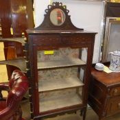 An Edwardian inlaid mahogany display cabinet