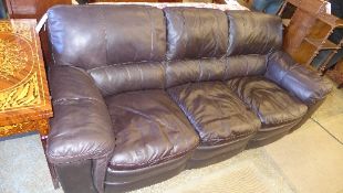 A three seater sofa upholstered in cogna