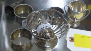 A silver pepper, a silver salt, napkin r