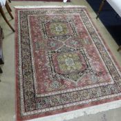 A Madras rug the rouge field with double