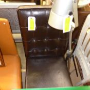 A modern leather high back side chair an