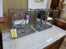 A pair of industrial style mirror insert