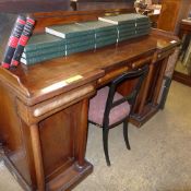 An early Victorian sideboard with three drawers and cupboard with turned columns