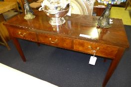 A C20th mahogany serving table the rectangular top above three drawers on tapered supports W 138 D
