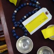 A lapis lazuli necklace with matching ea