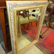 A wall mirror the rectangular top with b