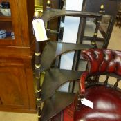 A Regency design ebonised and parcel gil