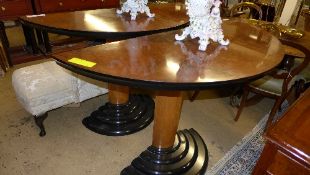A pair of demi lune Art Deco style console table on ebonised tiered base