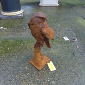 A cast iron garden statue of an eagle
