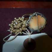 A 9ct gold cluster ring cameo, seed pear