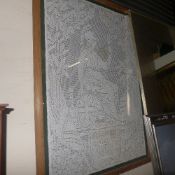 A framed and glazed cotton lace-like square panel of Brittania seated holding a trident and shield