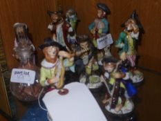 A collection of porcelain figures monkey