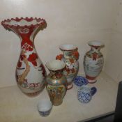 A collection of Oriental porcelain vases and a similar