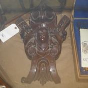 A C19th walnut carved wall applique