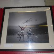 A football memorabilia photograph signed