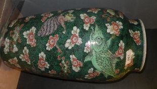 A C19th Chinese famille verte vase, decorated with mythical animals and prunus blossom on spiral