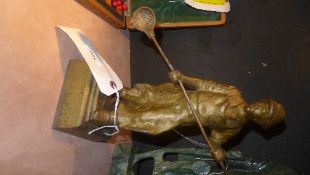 A heavy gilt metal figure of a European