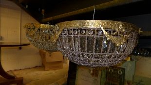 A pair of cut glass and brass ceiling lights