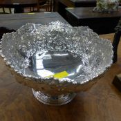 A silver plated embossed punch bowl
