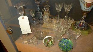 A collection glassware including paperweight, candlestick and glasses