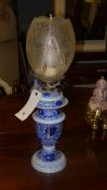 A blue painted opaline oil lamp