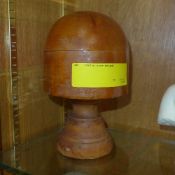 A millinery wooden hat stand