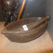 A cast iron mortar and pestle