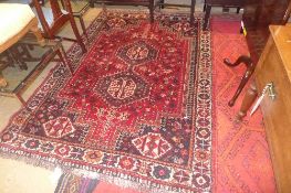 A contemporary carpet with two central m