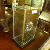 A skeleton clock within glass case
