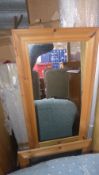 A pine wall hanging mirror and one other